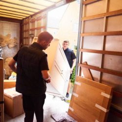 Removal company helping a family move out of their old home