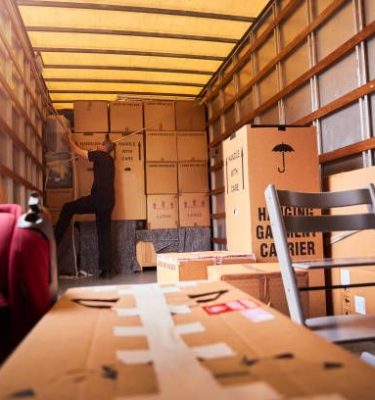 Removal company helping a family move out of their old home